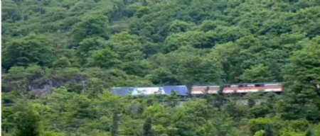 高山森林间建设火车轨道火车高速山林间经过高清视频拍摄免费下载